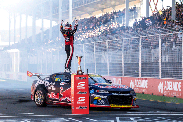 Picture of Will Brown standing on his car after winning.